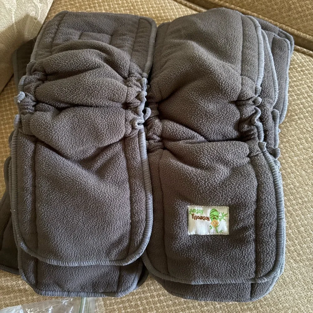 Disposable inserts, cloth inserts and diaper washing system